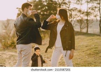 Stylish Family Walking On A Spring Field