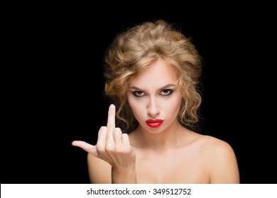 Stylish fashion blonde girl showing middle finger. isolated on a black background