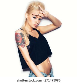 Stylish Fashionable Blonde Girl Hipster With Tattoo In Black Clothes.  White Background, Not Isolated