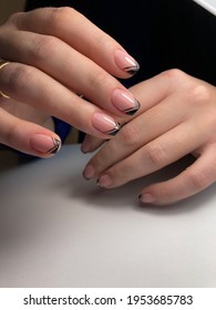 Stylish fashionable female manicure. Hands of a beautiful young woman and modern design. - Shutterstock ID 1953685783