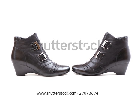 Stylish female boots of black colour of graceful modern design.