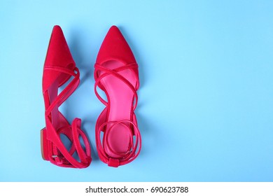 Stylish Flat Shoes On Color Background