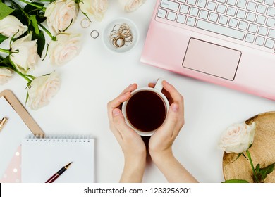 Stylish flatlay frame arrangement with pink laptop, tea, roses, glasses and other accessories on white. Feminine business mockup, copyspace - Powered by Shutterstock