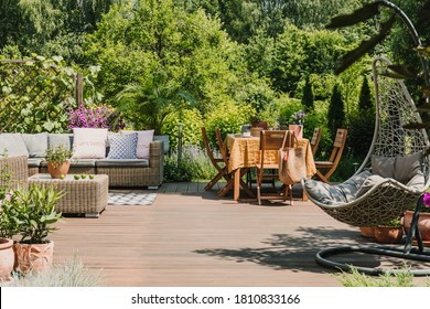 Stylish garden decoration with fancy egg chair and garden furniture