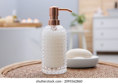 Stylish Glass Dispenser And Soap Bar On Wicker Stool In Bathroom