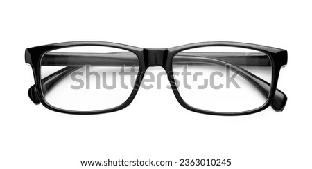 Stylish glasses with black frame isolated on white, top view
