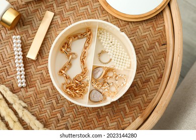 Stylish Golden Bijouterie On Wicker Table, Top View