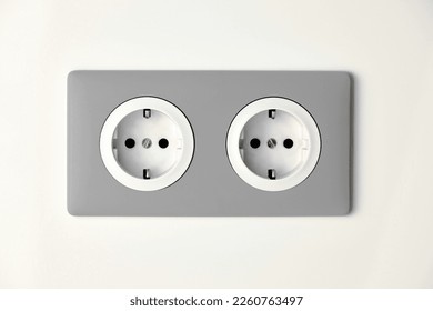 Stylish gray Electric Outlet. Power outlet on the wall. Euro type electric outlet on wall. - Shutterstock ID 2260763497