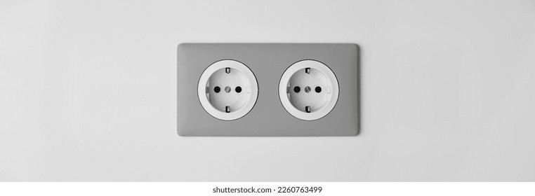 Stylish gray Electric Outlet. Power outlet on the wall. Euro type electric outlet on wall. - Shutterstock ID 2260763499