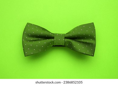 Stylish green bow tie on lime color background, top view - Powered by Shutterstock