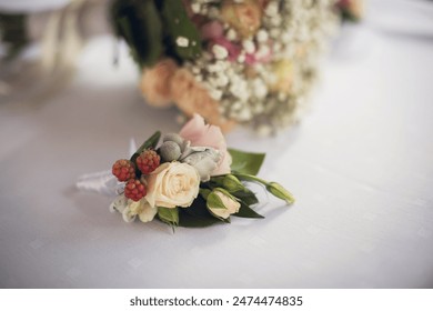 Stylish groom boutonniere. A wedding bouquet and a boutonniere of roses in gentle tones. - Powered by Shutterstock