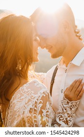 Stylish Groom Kissing Gorgeous Bride In Sun Light, Perfect Moment, Boho Wedding Couple