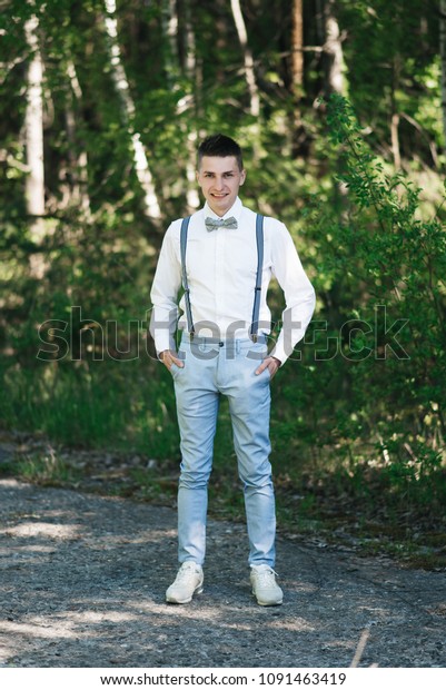 blue pants white shirt and tie