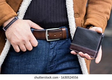 the stylish guy was wearing a belt and a wallet