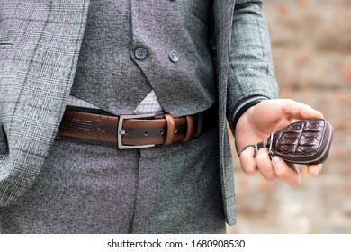 The Stylish Guy Was Wearing A Belt And A Wallet