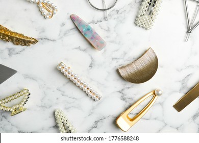 Stylish Hair Clips On White Marble Table, Flat Lay