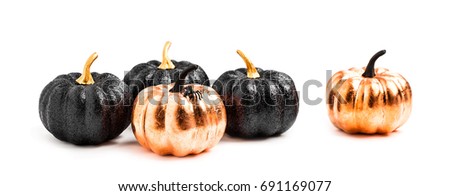 Stylish Halloween decorations. Shiny Decorative Pumpkins. Minimal creative stillife. Isolated
