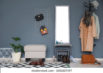 Stylish Hallway Interior With Large Mirror And Coat Rack