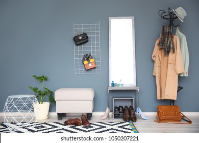 Stylish Hallway Interior With Large Mirror And Coat Rack