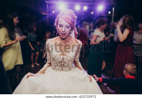 Stylish Happy Bride Dancing Wedding Reception Stock Image