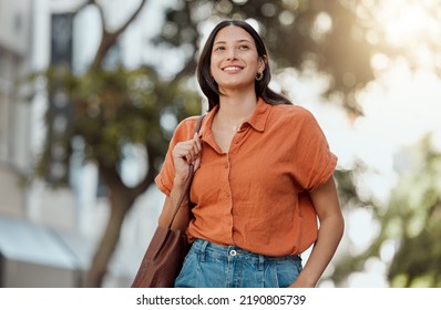 Stylish, happy and trendy student walking in a city, commuting to a college and enjoying a weekend break downtown. Smiling, edgy or funky woman exploring, visiting and enjoying town while - Powered by Shutterstock