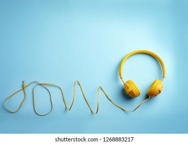 Stylish headphones on color background, top view. Space for text - Shutterstock ID 1268883217