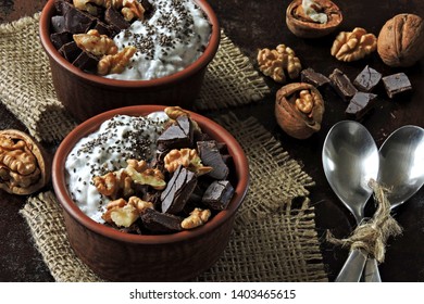 Stylish healthy breakfast or snack. Chia yogurt, chocolate and walnuts. Keto diet. Keto breakfast.