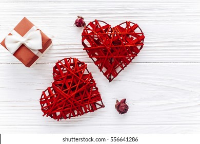 Stylish Hearts And Roses And Gift Boxes On White Wooden Background. Happy Valentines Day Concept. Greeting Card Flat Lay With Space For Text. Wedding Or Birthday Gifts Accessories 