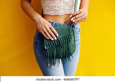 Stylish Hippie Girl With Green Vintage Suede Fringe Handbag . Fashion Outfit And Fashion Concept