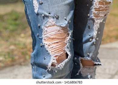stylish hole on jeans / strange fashion modernity