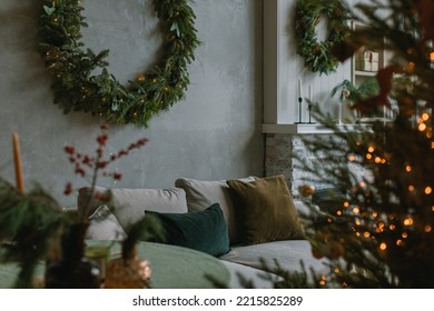 Stylish home interior with Christmas wreath and  Christmas tree, festive decorations for winter holidays celebration. Evening atmosphere. - Powered by Shutterstock