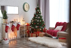 Stylish Interior With Beautiful Christmas Tree And Decorative Fireplace