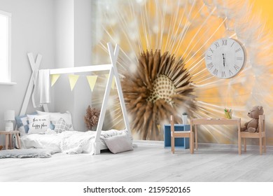 Stylish interior of children's room with printed beautiful blowball on wall