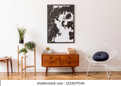 Stylish interior design of living room with wooden retro commode, white armchair, footrest and elegant personal accessories. Mock up poster frame on the wall. Template. Vintage home decor. - Shutterstock ID 1523679146