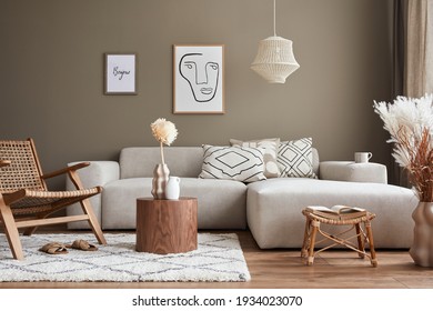 Stylish interior with design neutral modular sofa, mock up poster frames, rattan armchair, coffee tables, dried flowers in vase, decoration and elegant personal accessories in modern home decor. - Shutterstock ID 1934023070