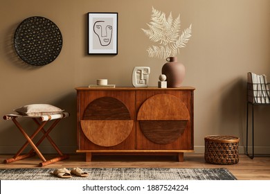 Stylish Interior With Design Wooden Commode, Stool, Dried Flowers In Vase, Unique Decoration, Carpet, Mock Up Poster Frame And Elegant Personal Accessories. Modern Living Room In Classic House.