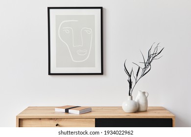 Stylish Interior Of Living Room With Mock Up Poster Frame, Wooden Commode, Book, Leaf In Ceramic Vase And Elegant Personal Accessories. Minimalist Concept Of Home Decor. Template.