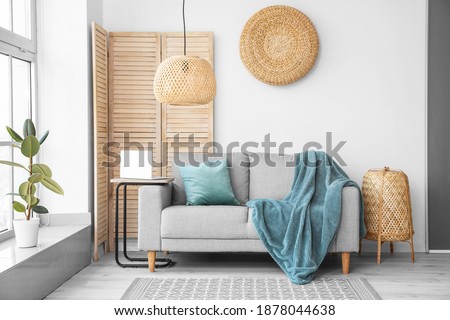 Stylish interior of living room  with sofa