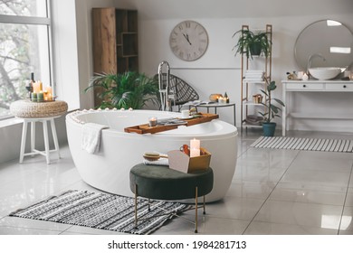 Stylish interior of modern bathroom with burning candles - Powered by Shutterstock