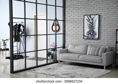 Stylish interior of modern hall in studio apartment - Shutterstock ID 2008427234