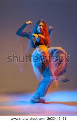 Stylish jazz-funk dancer in motion under vivid studio lighting, with glowing colors and urban dance energy.