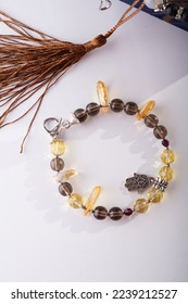 stylish jewelry bracelet with semiprecious  around white background. hobby and fashion concept. flat lay - Shutterstock ID 2239212527
