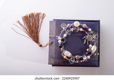 stylish jewelry semiprecious bracelet with present box around white background. hobby and fashion concept.  - Shutterstock ID 2240925907