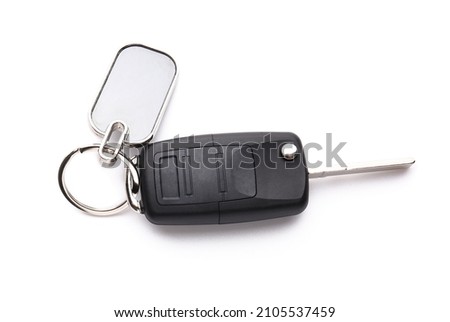 Stylish keychain with car key on white background