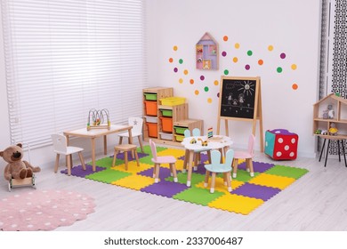 Stylish kindergarten interior with toys and modern furniture - Shutterstock ID 2337006487