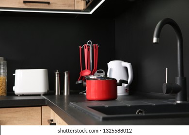 Stylish kitchen counter with houseware and appliances