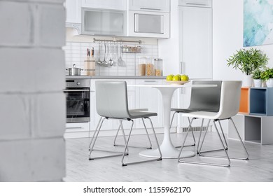 Stylish Kitchen Interior With Dining Table And Chairs Stylish Kitchen Interior With Dining Table And Chairs