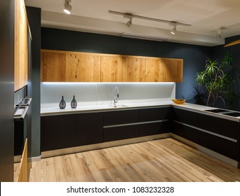 Stylish kitchen with modern white counter and sink - Shutterstock ID 1083232328