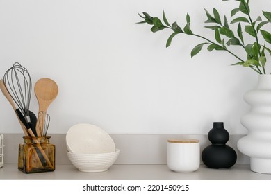 Stylish kitchenware and decor on surface in kitchen. Home comfort. Organizational space in kitchen. Set of utensils. Contemporary flat for sale. Cozy place for living - Shutterstock ID 2201450915