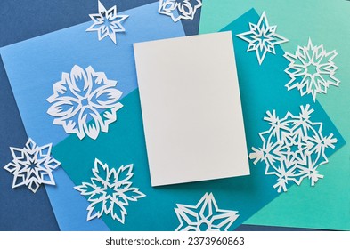  A stylish layout to showcase your winter holiday greetings. Cute vintage Christmas New Year gifts mockup on paper background. Flat lay top view.                               - Shutterstock ID 2373960863